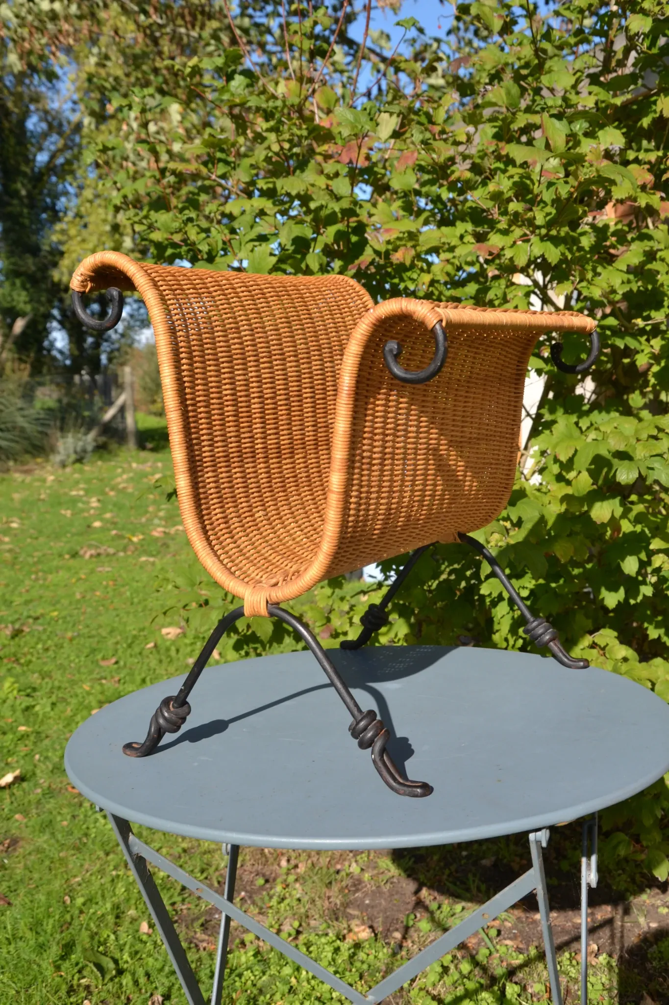 Wrought iron and rattan magazine/newspaper rack