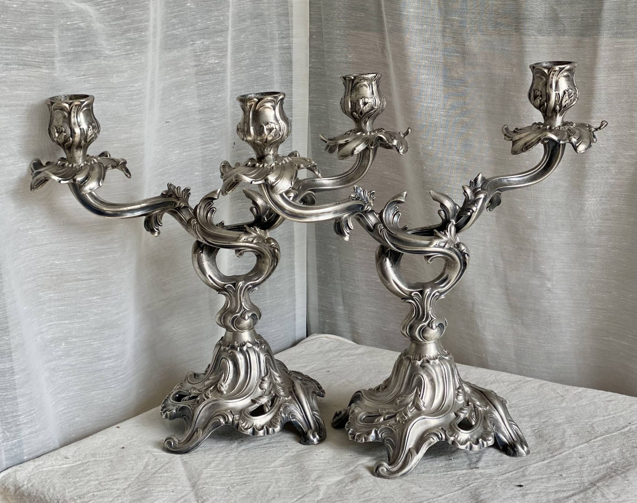 Pair of vintage 1950s silver-plated metal rocaille chandeliers