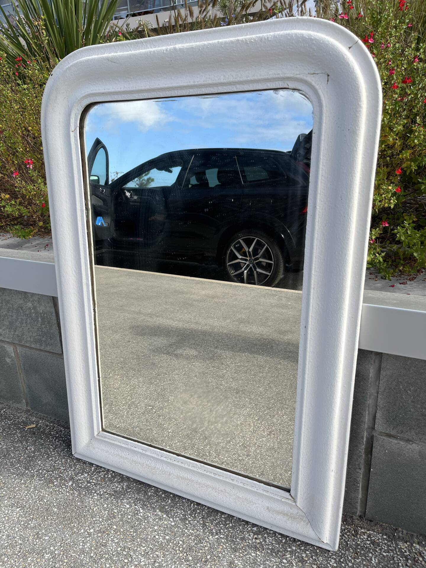 Large white mirror from the early century.