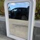 Large white mirror from the early century.