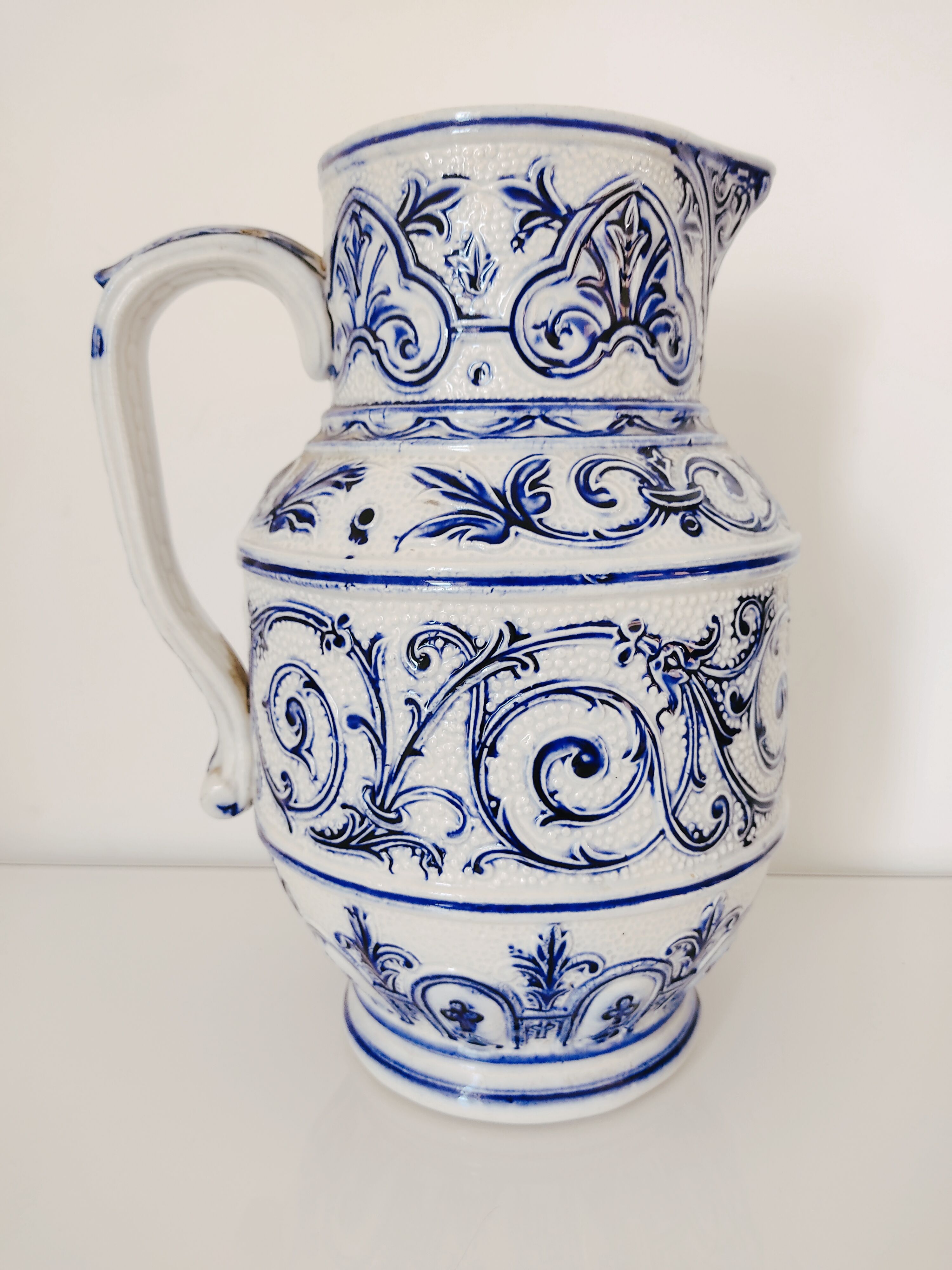 Blue and white pitcher