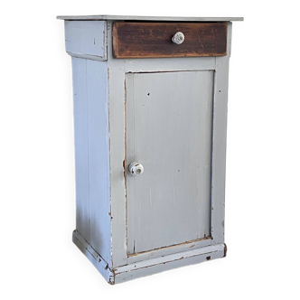 Old patinated gray bedside table