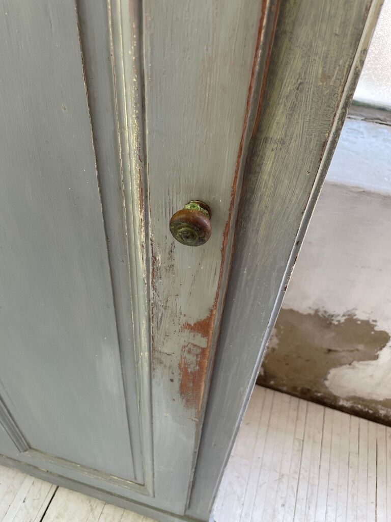 Blue patinated cap cabinet
