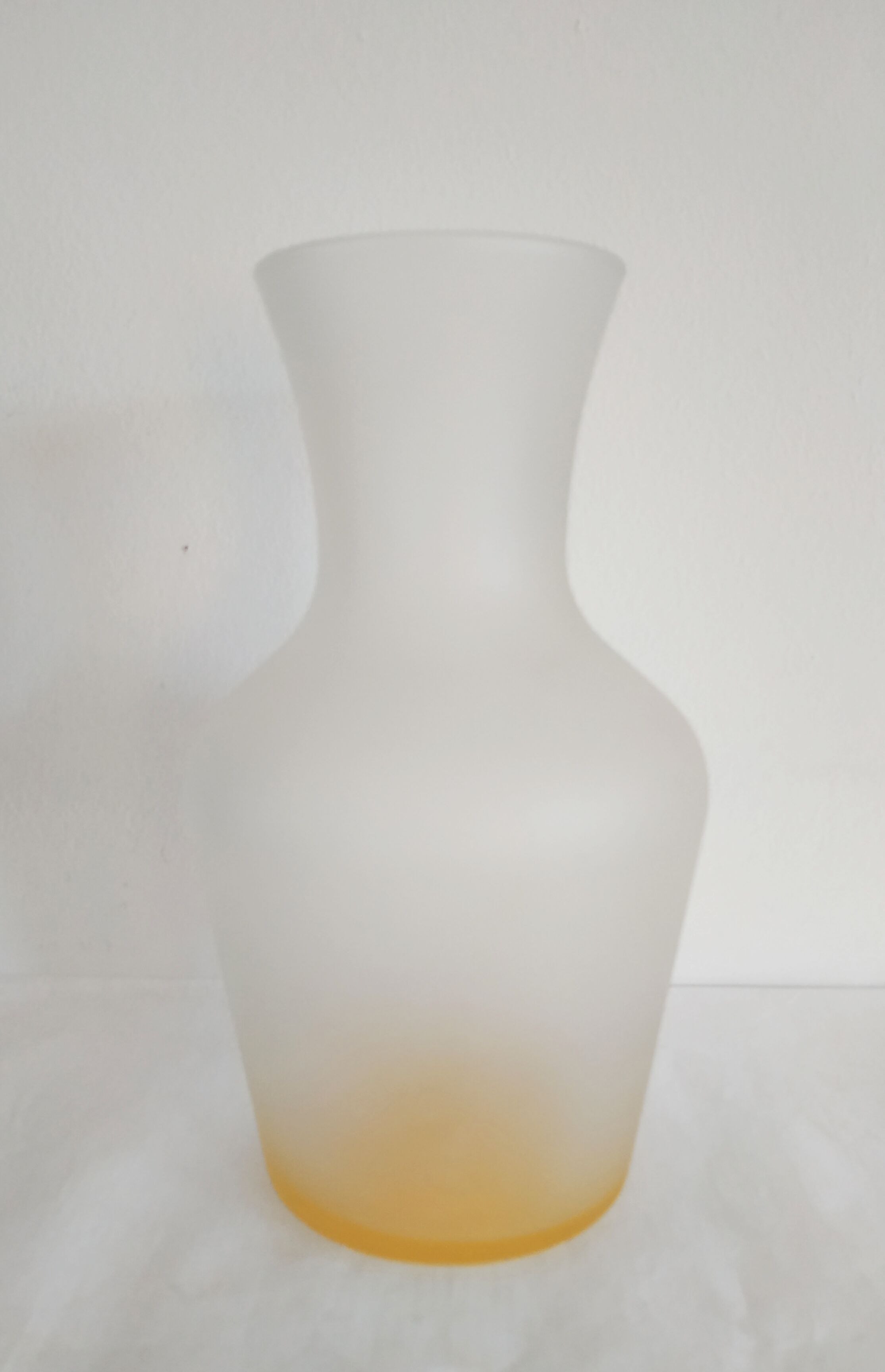 Frosted glass carafe with yellow bottom