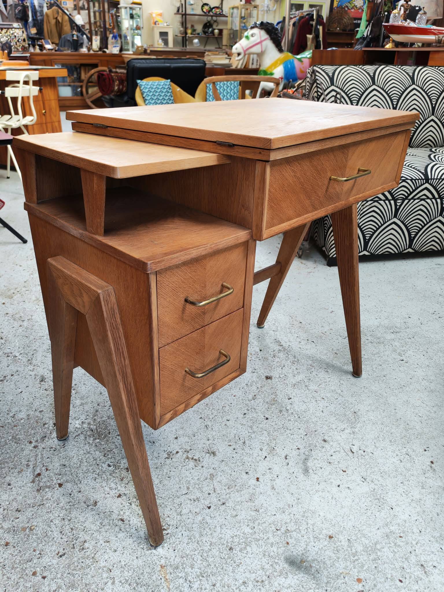 Vintage 1950s side desk with tapered legs.