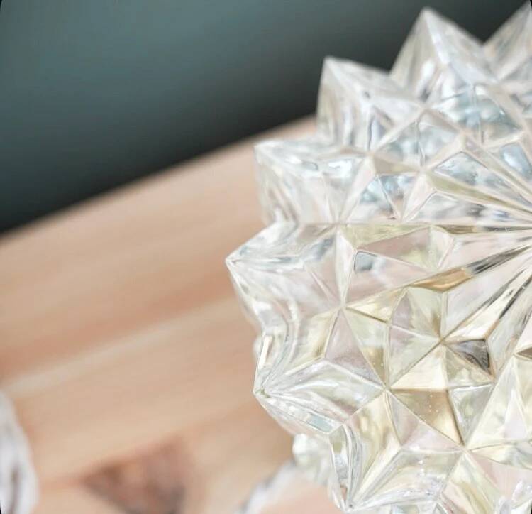 Table lamp with cut glass in the shape of a star.