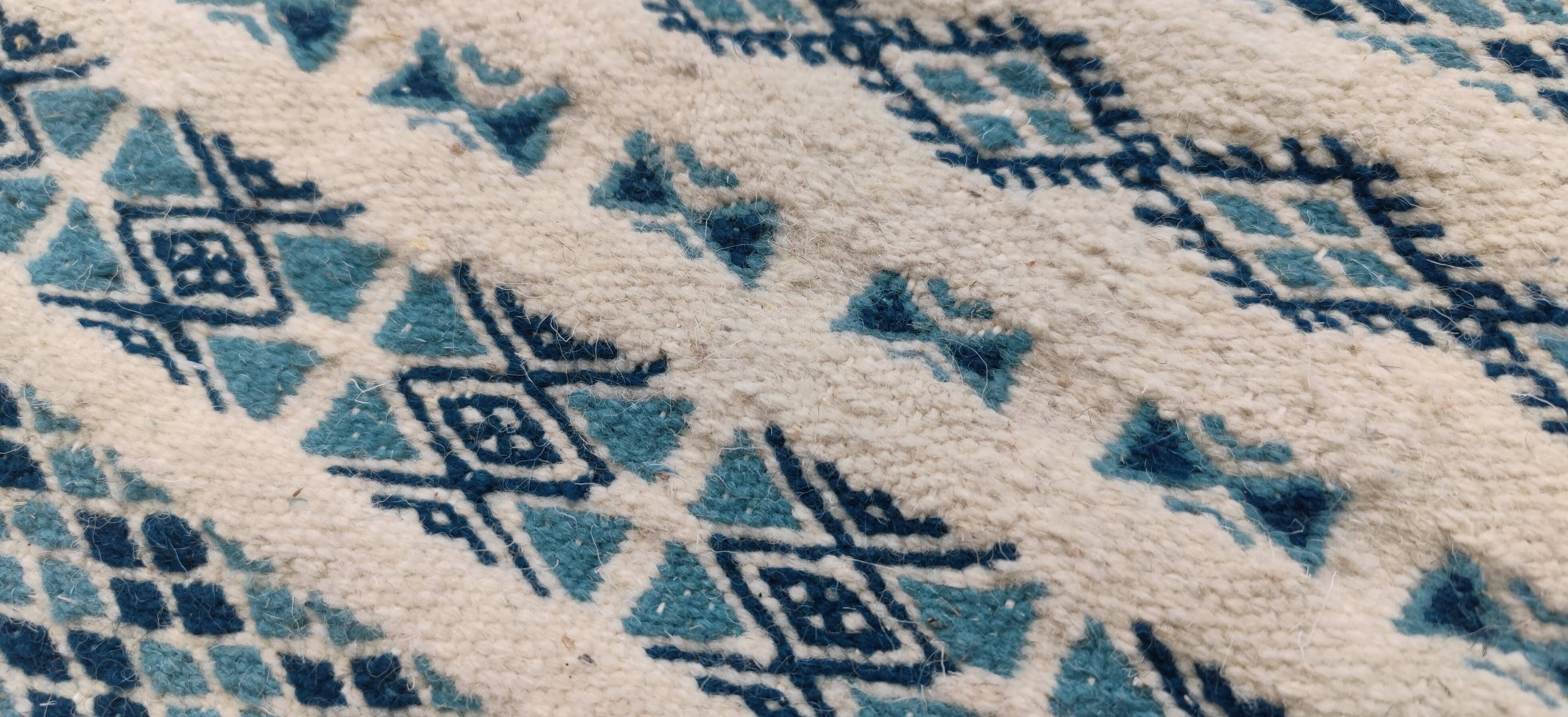 Traditional handmade white and blue carpet