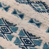 Traditional handmade white and blue carpet