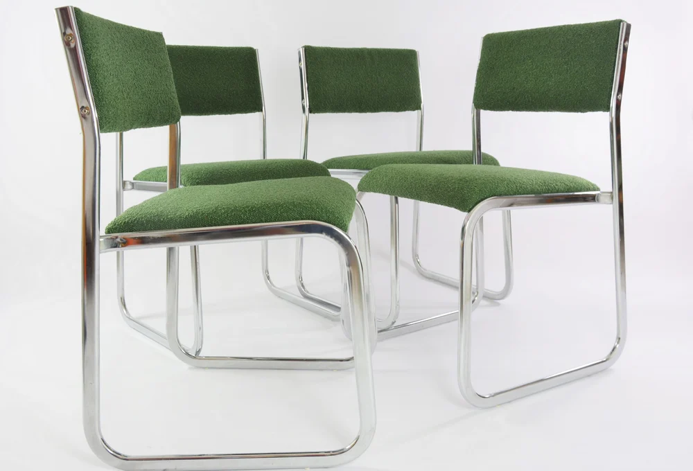 Chrome metal sled chair with green fabric
