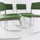 Chrome metal sled chair with green fabric