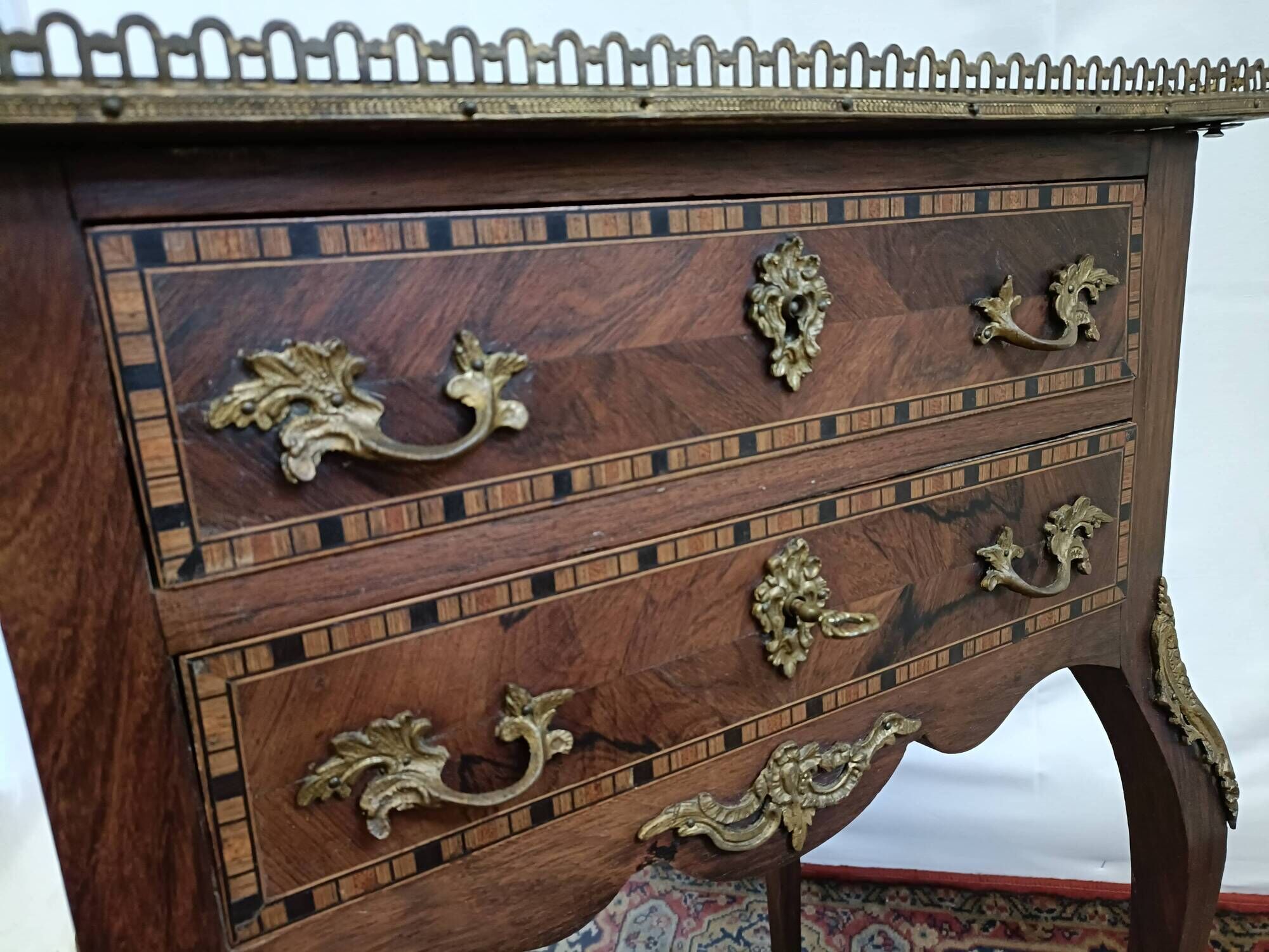 Small Louis XV chest of drawers in inlaid wood