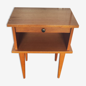 Old vintage bedside table with a scandinavian drawer