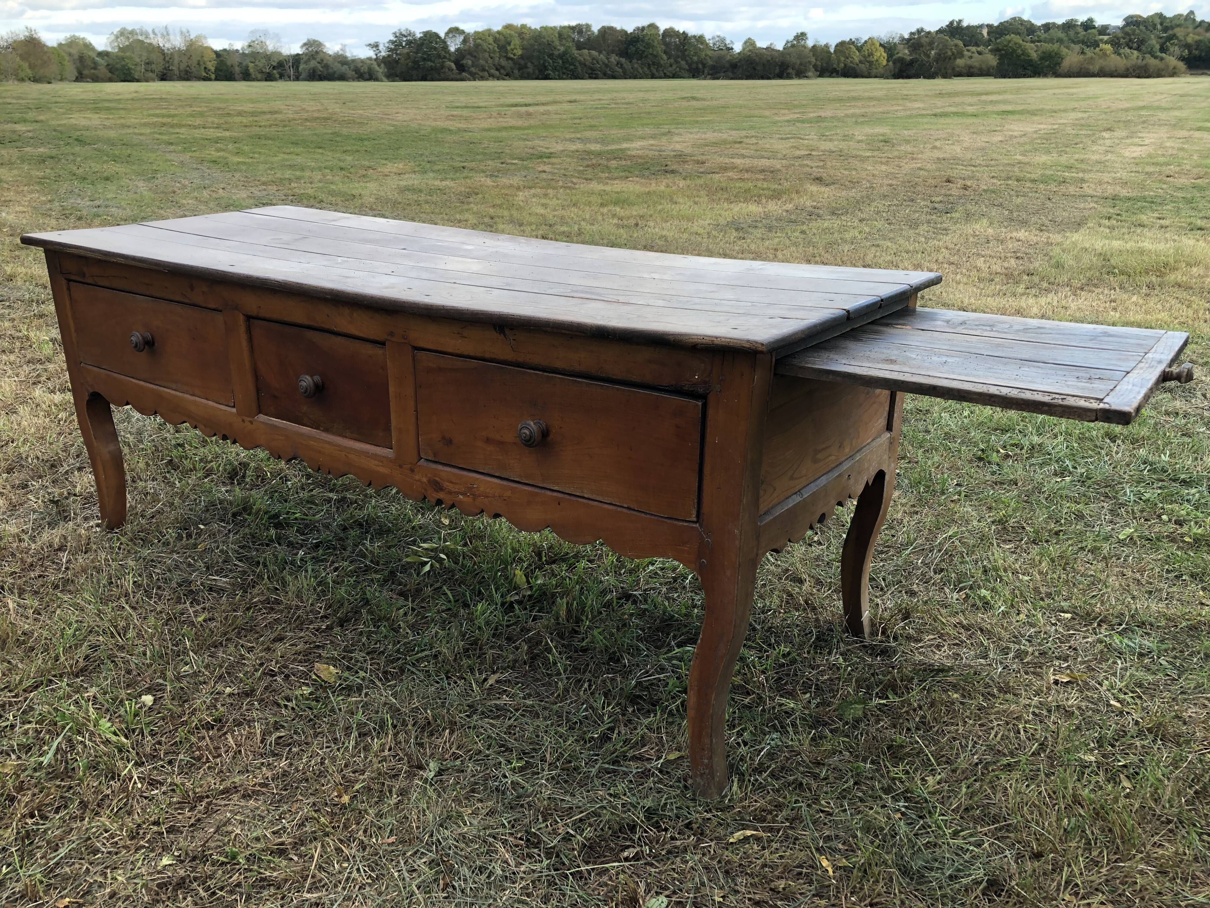 Antique Louis XV paneled table with 3 front drawers in solid cherry wood