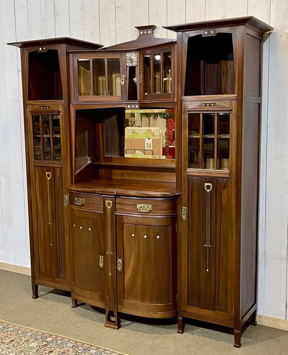 Art Nouveau mahogany buffet with clock in the style of G. Serrurier Bovy.