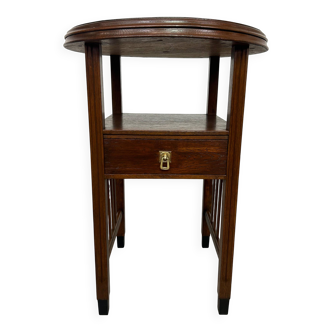 Art Deco round table with a brass top.