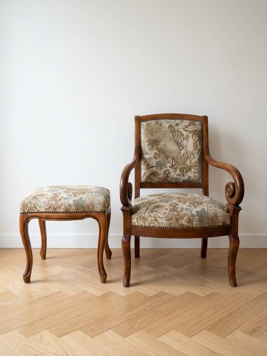 Old armchair with its stool