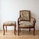 Old armchair with its stool