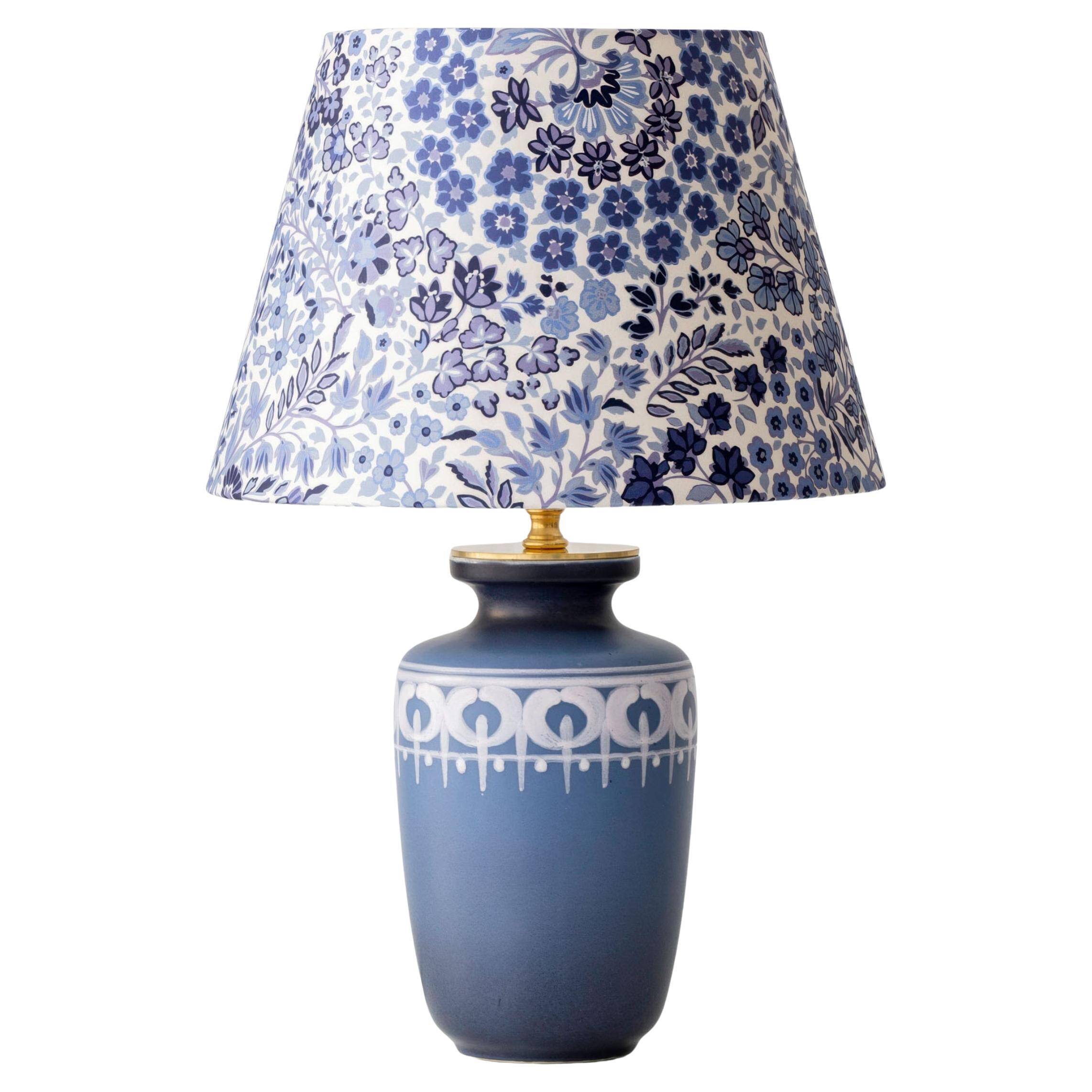 Mid-century modern blue ceramic table lamp with new Liberty London floral shade.