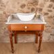 Antique washbasin cabinet in solid pitch pine with a white marble top.
