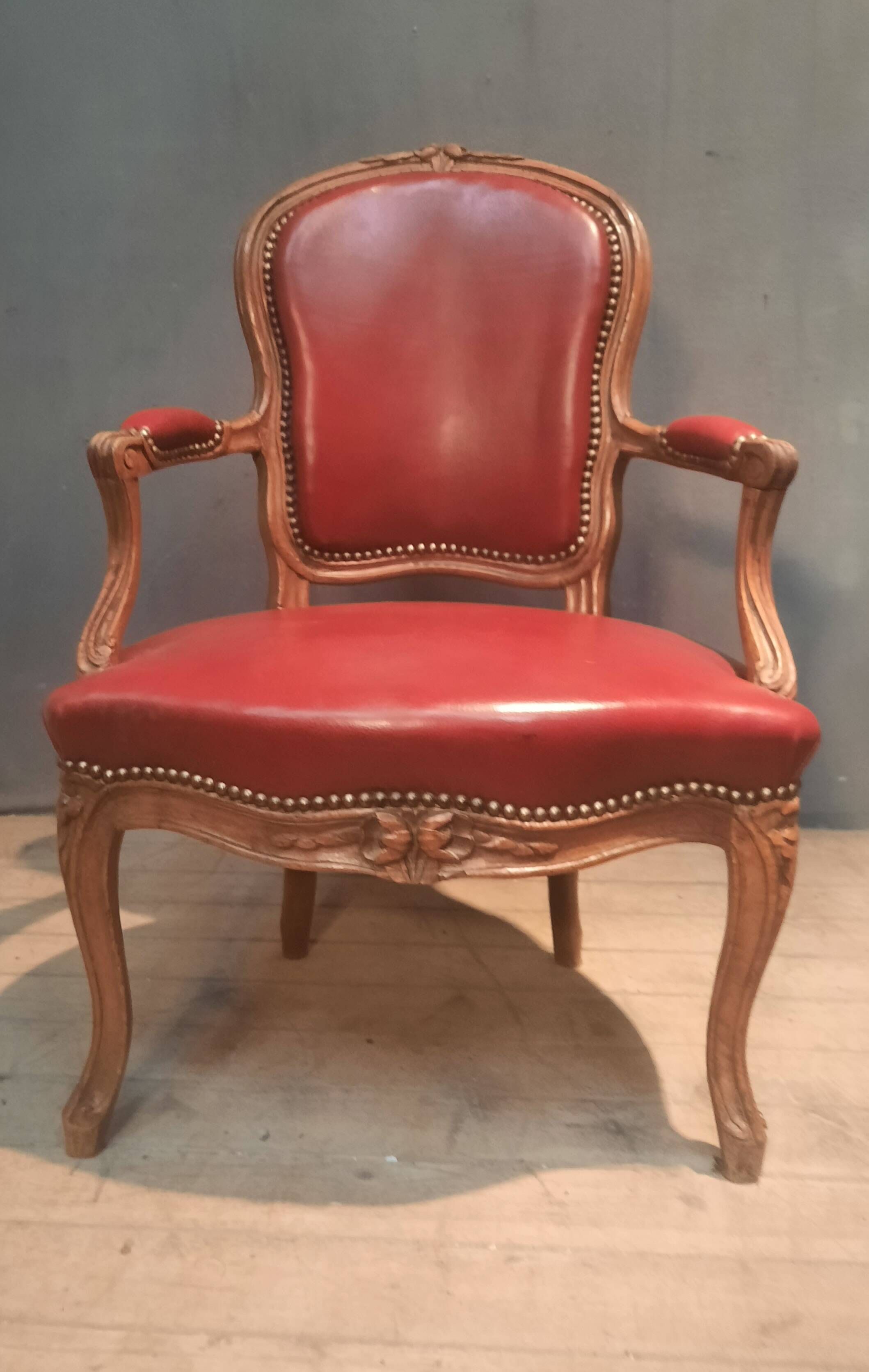 Louis XV period armchair covered in leather.