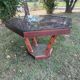Handcrafted hexagonal wooden table with natural decor.