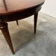 Extendable mahogany round table in Louis XVI style