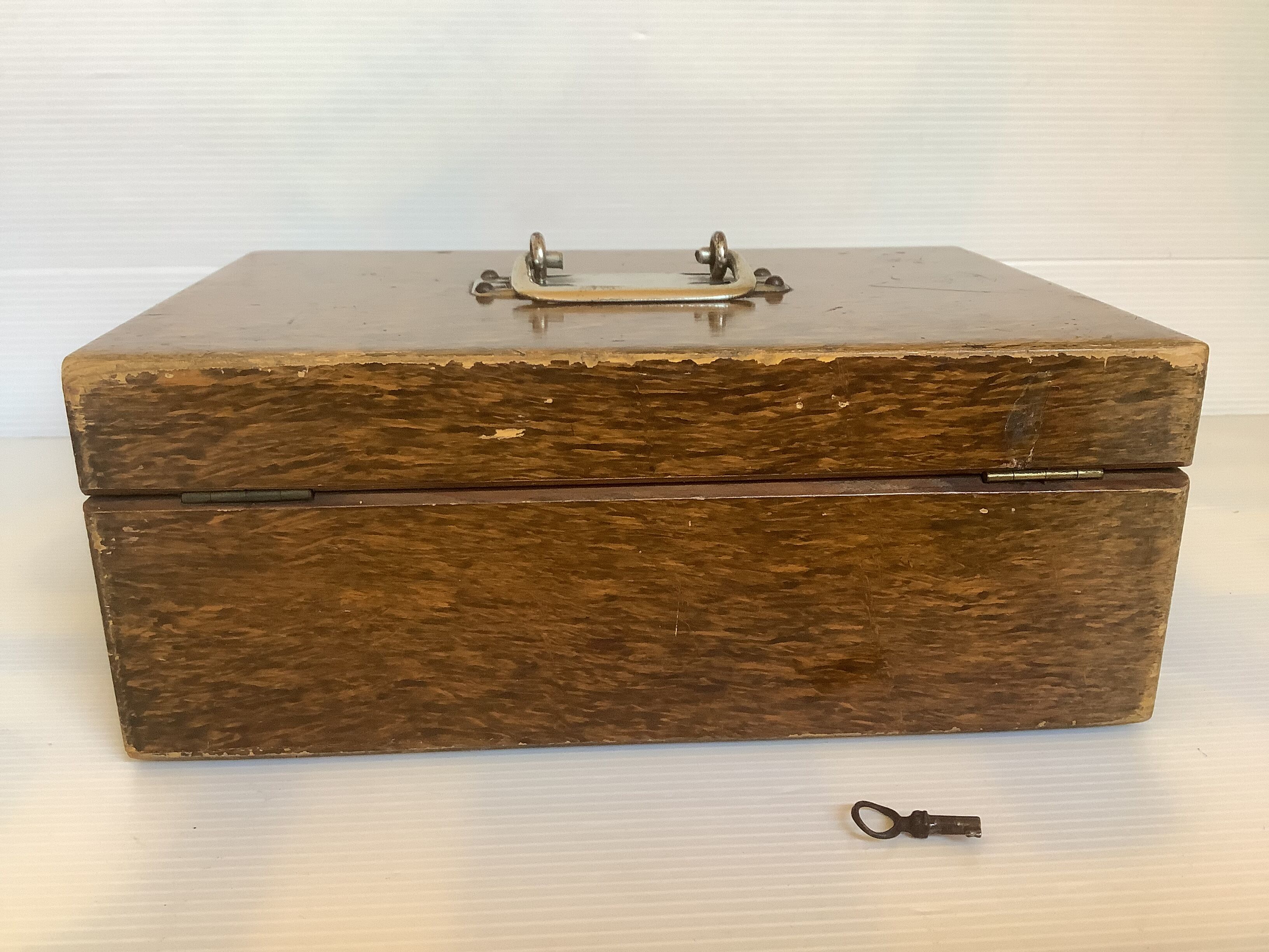 Old wooden box with handle and metal keys
