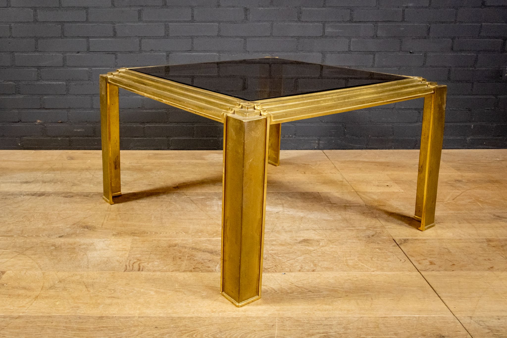 Coffee table made of brass and glass.