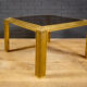 Coffee table made of brass and glass.