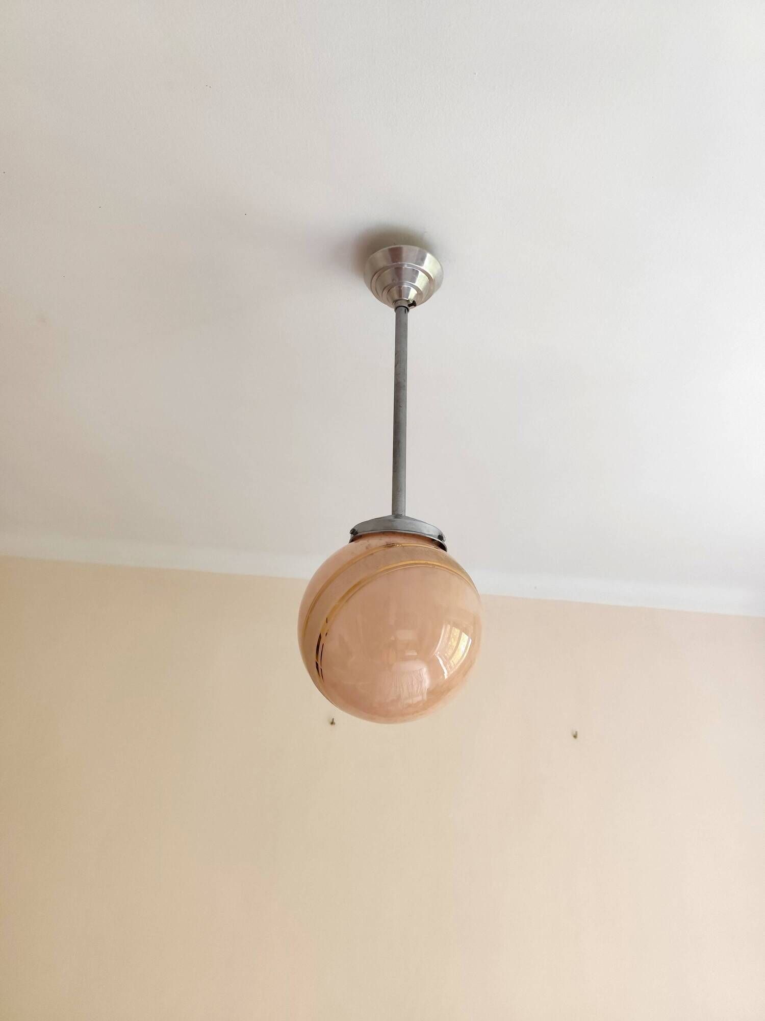 suspension glass globe pink and gold on a metal aluminium stem and structure