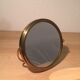 Vintage magnifiing gold round barber mirror