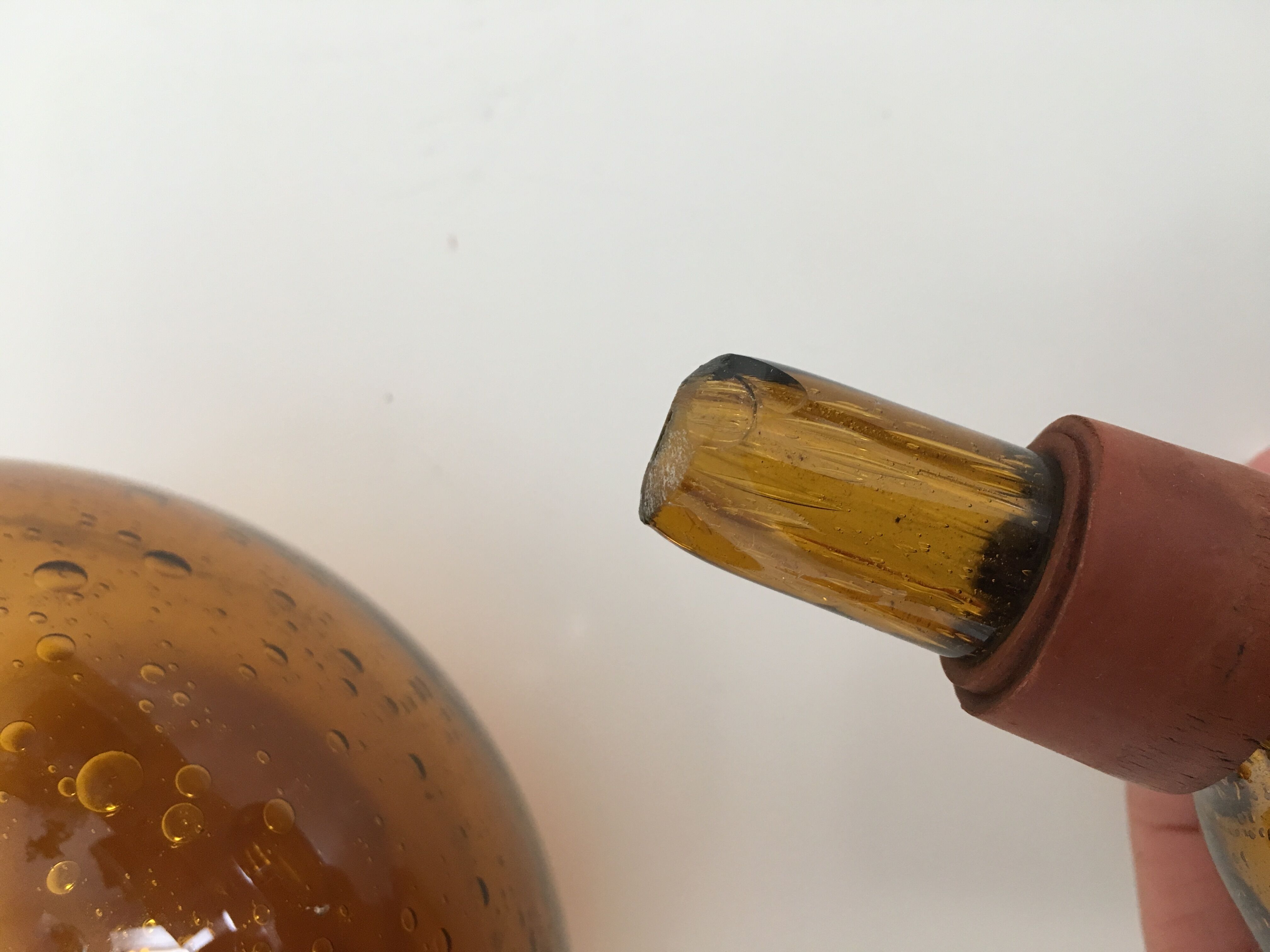Biot blown glass amber bottle