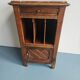 Wooden bedside table with book storage