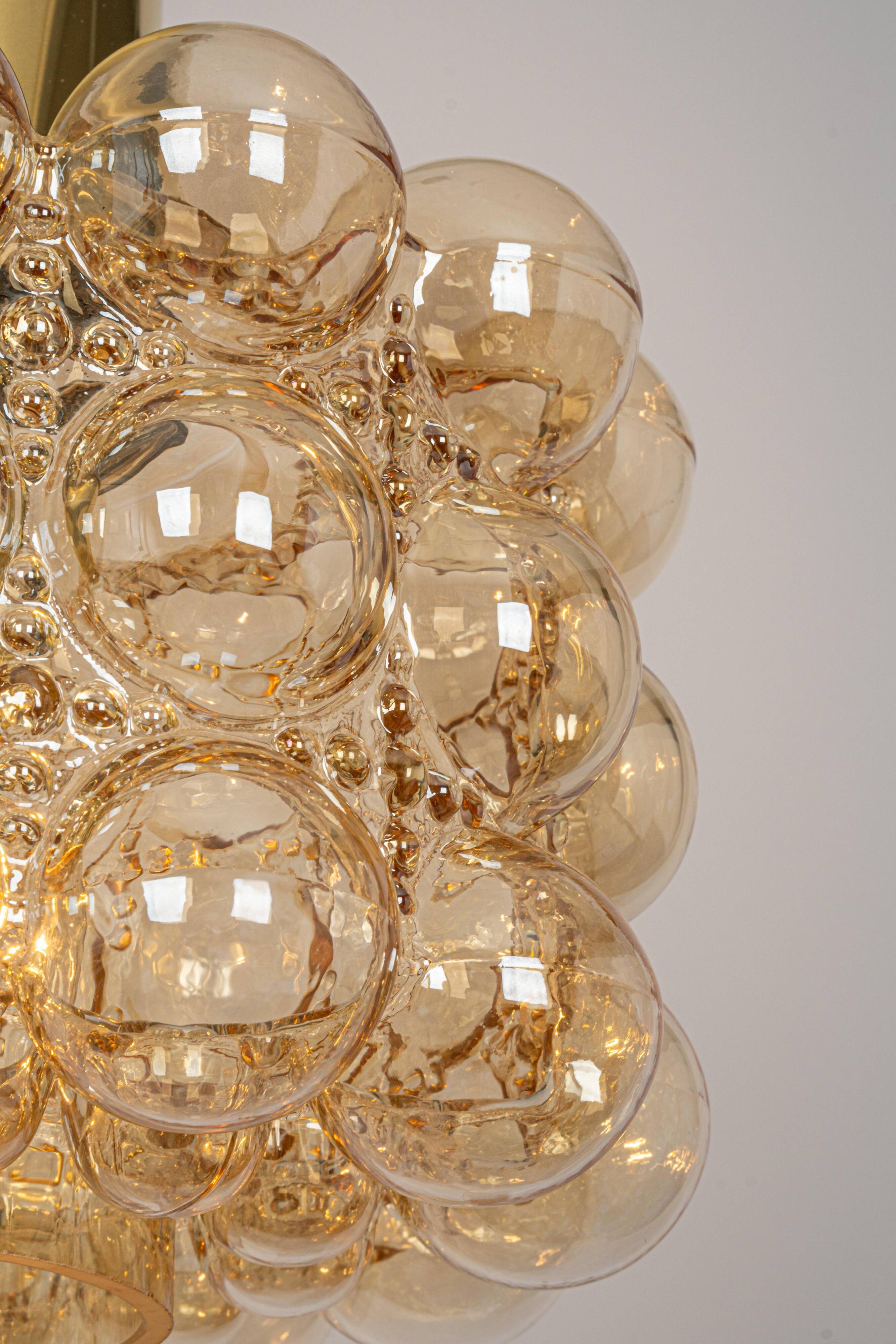 Large amber bubble glass pendant by Helena Tynell for Limburg, Germany, 1970s.