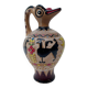 Clay pitcher with a bird head