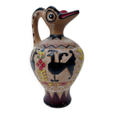 Clay pitcher with a bird head