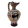Clay pitcher with a bird head
