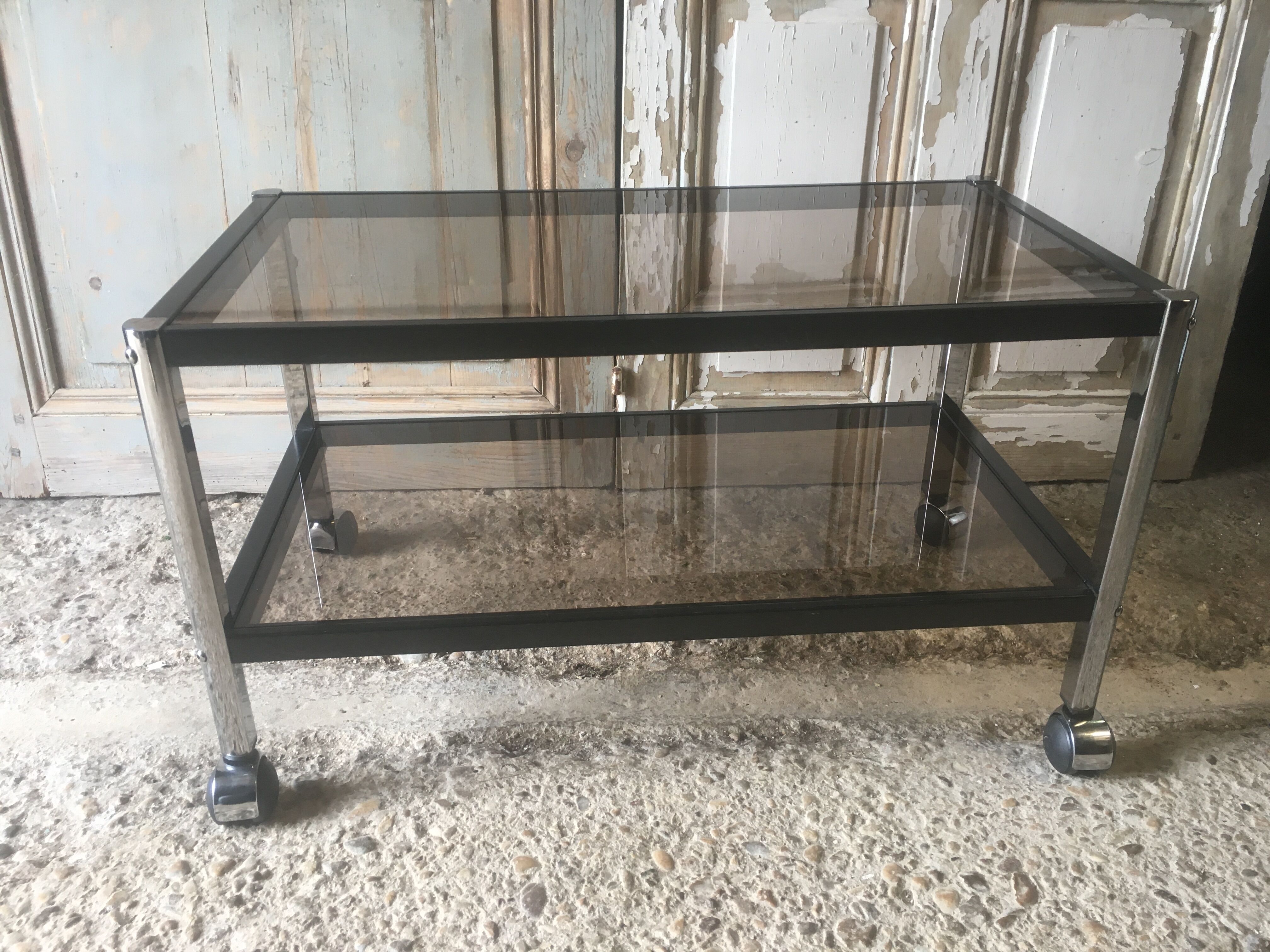 Metal coffee table with smoked glass.