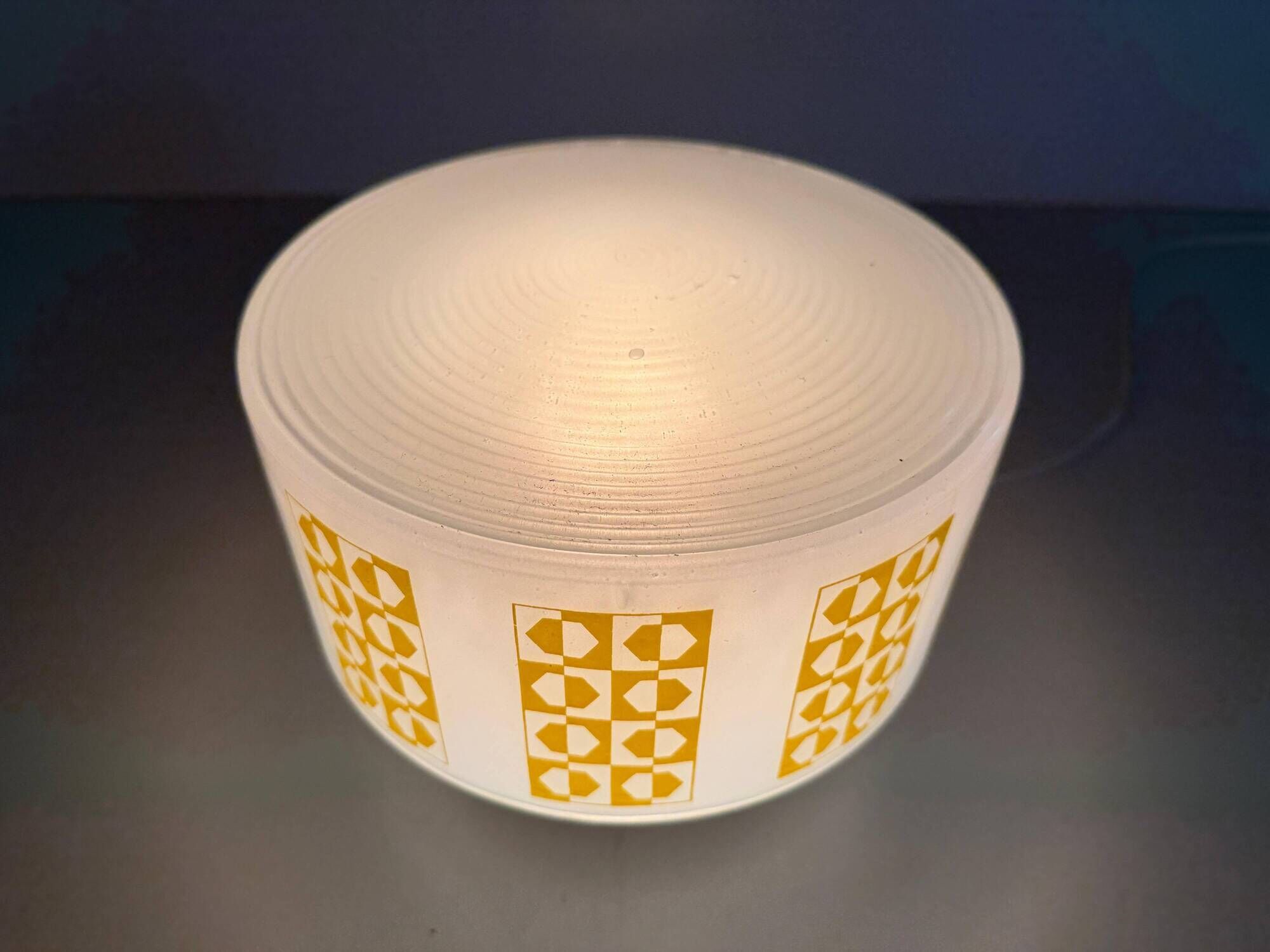 Ceiling light or wall sconce in opal glass with yellow decorations by VEB, 1950s, Germany.
