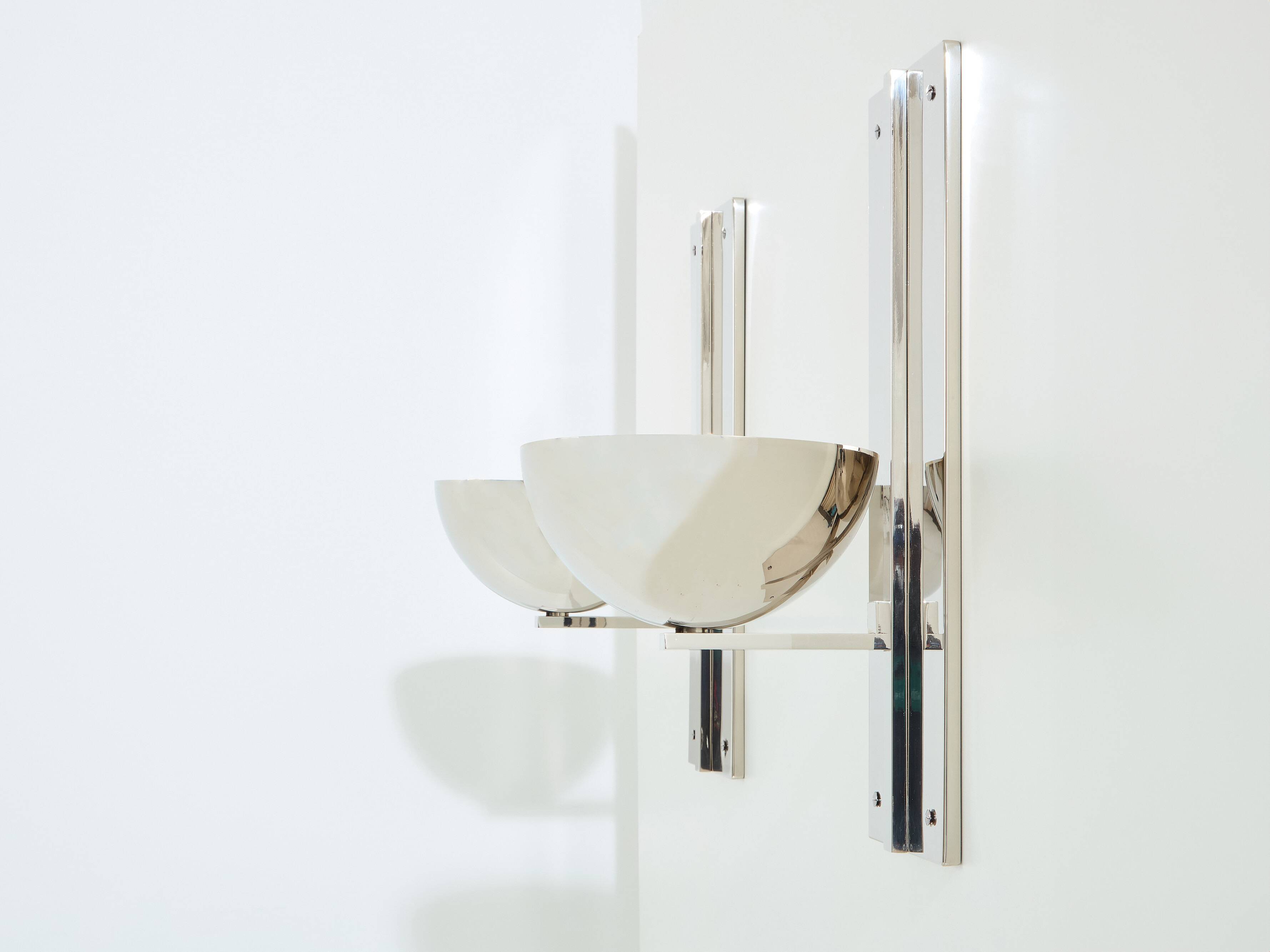Pair of modernist wall lights by Claude Parent, nickel-plated steel, 1992.
