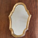 Miroir doré de style Louis XV sobre 32 X 22