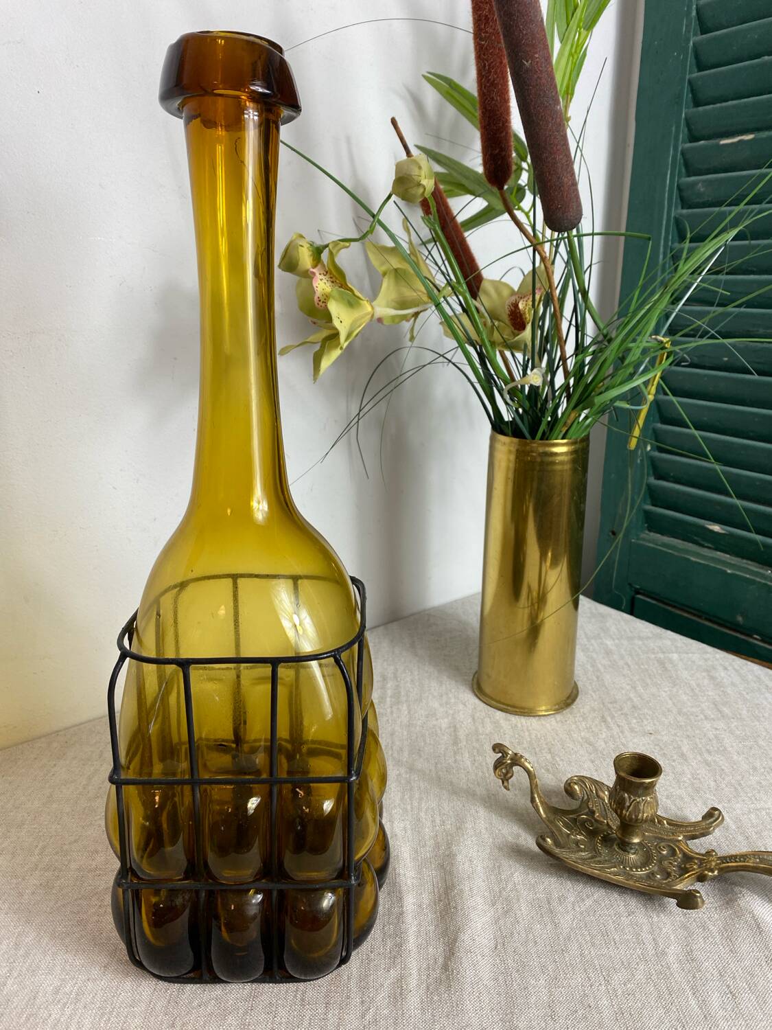 Glass carafe encased in wrought iron