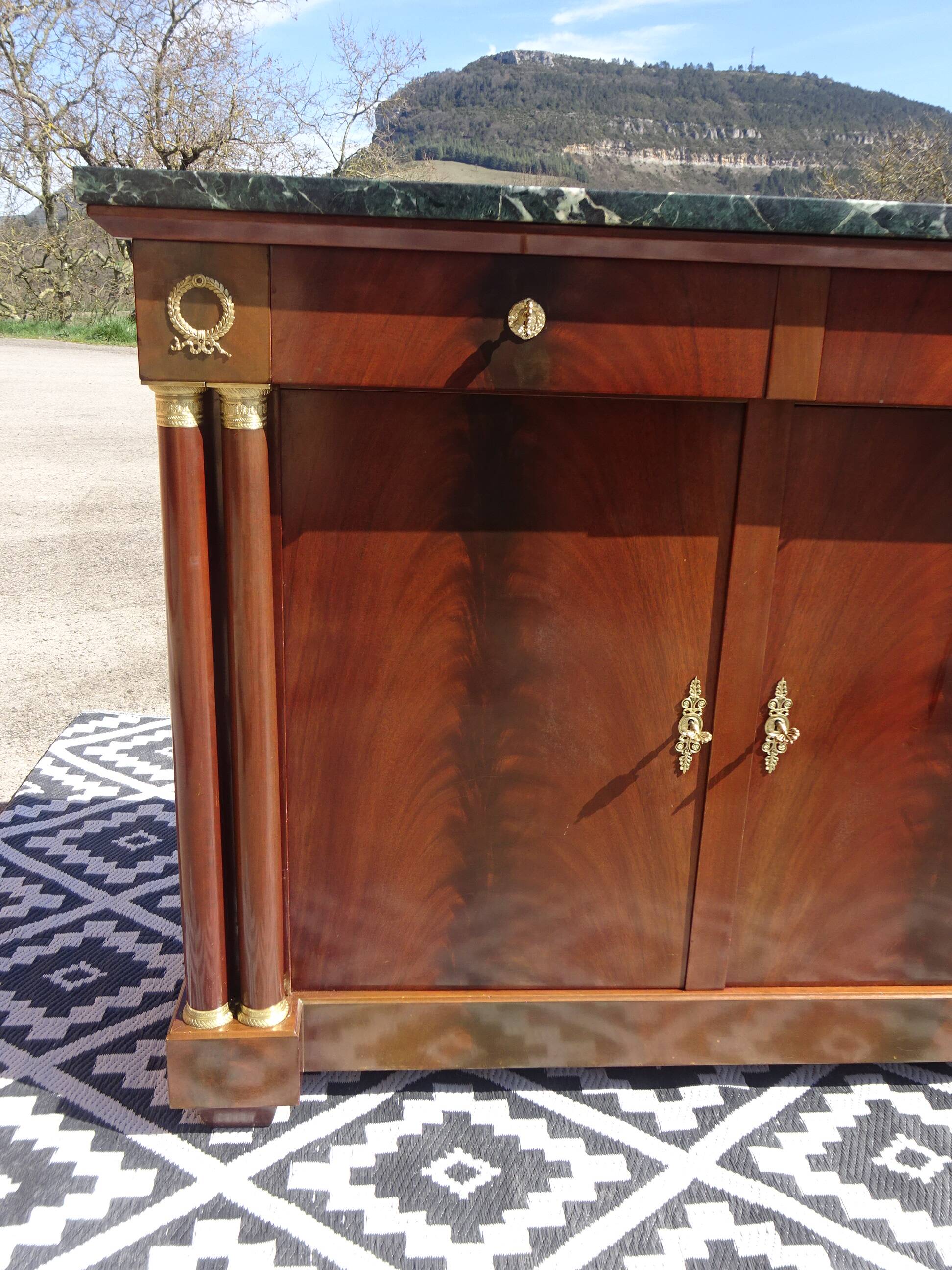 Flamed mahogany enfilade with sea green marble in Empire style.