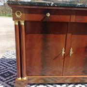 Flamed mahogany enfilade with sea green marble in Empire style.