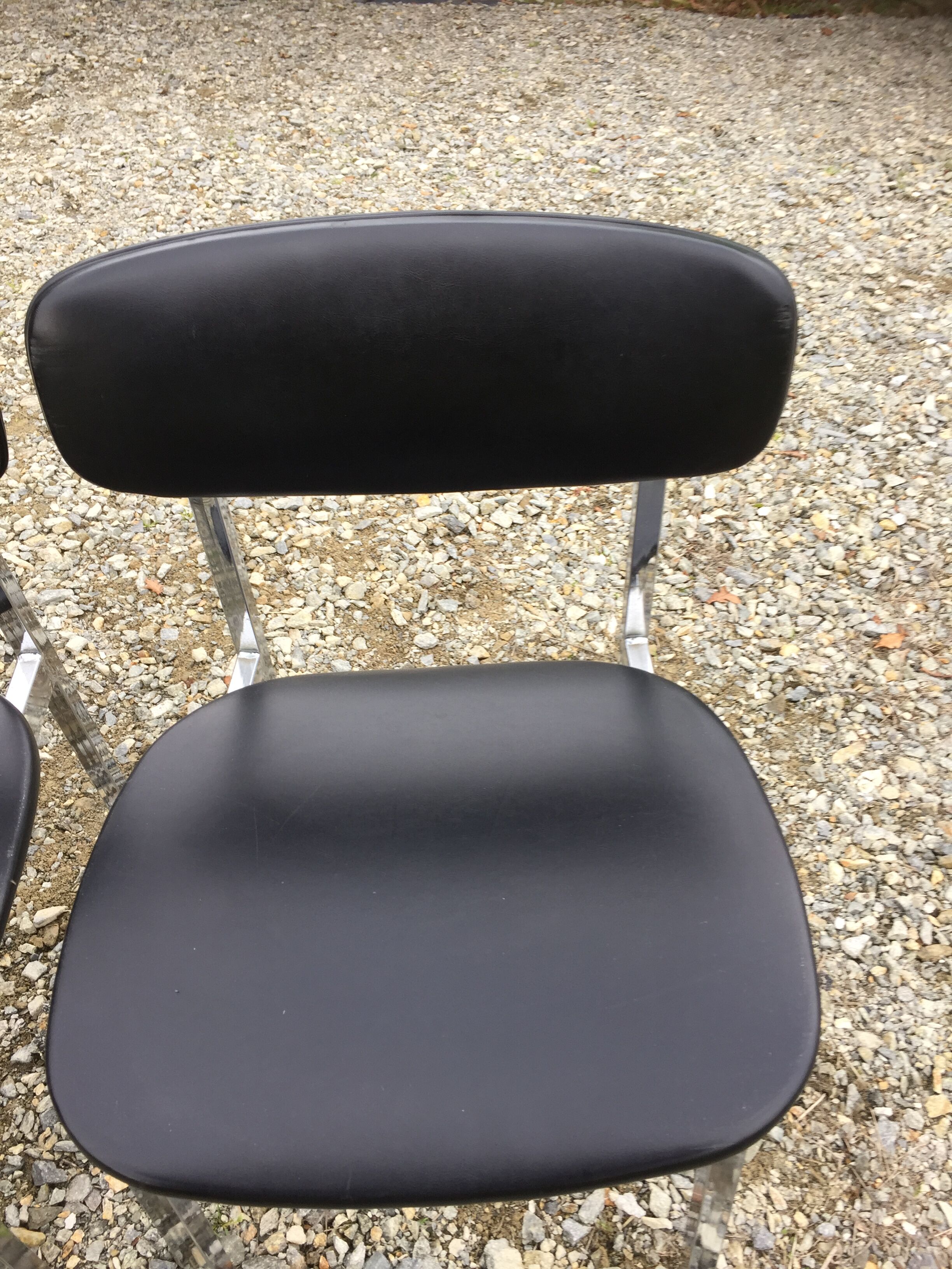 6 vintage chairs in black skaï with chrome metal tubular base.