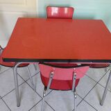 Table in red formica, 4 roc chairs, 2 extension cords, 2 drawers 60