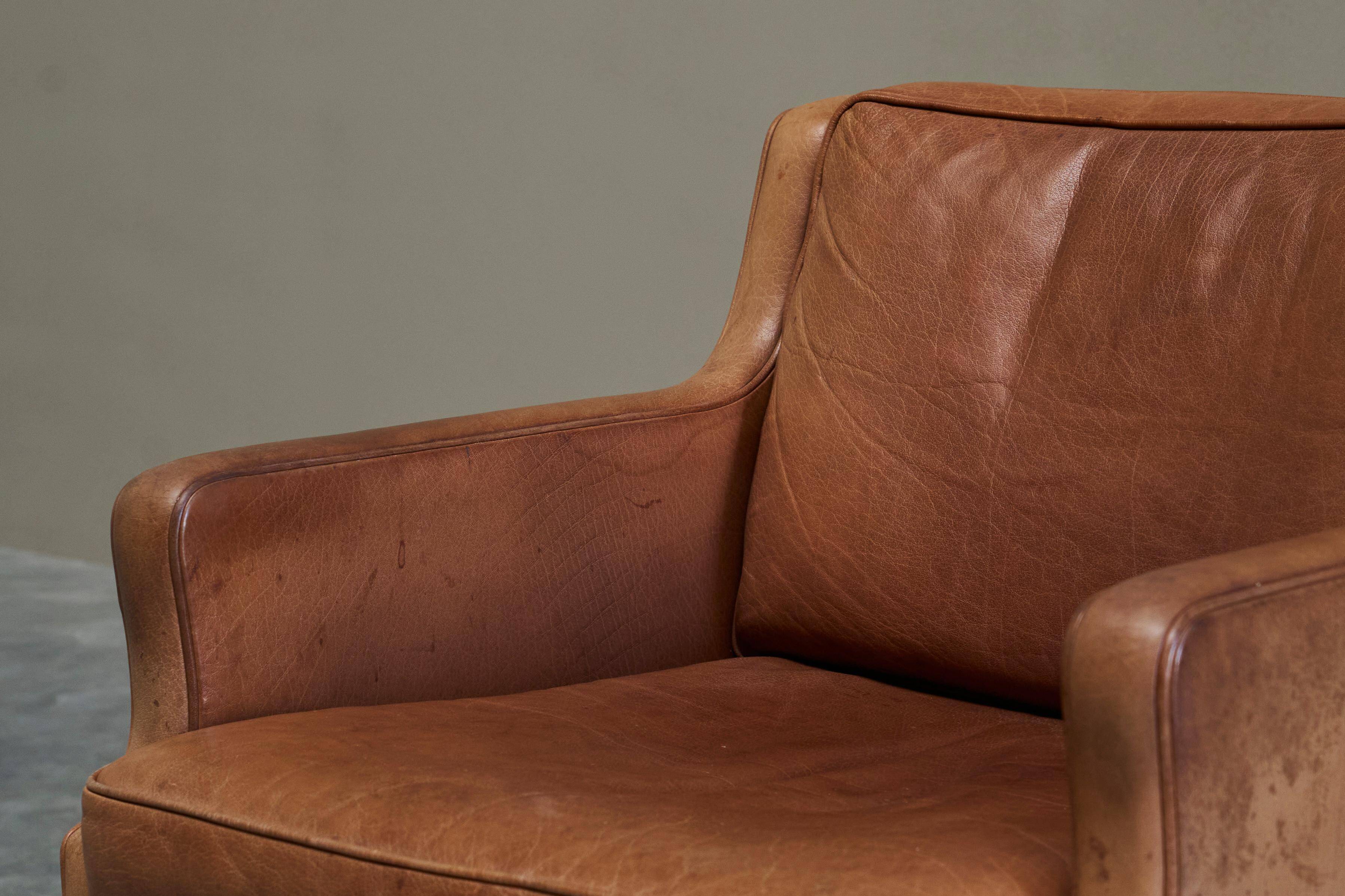 1970s patinated leather Scandinavian lounge chair