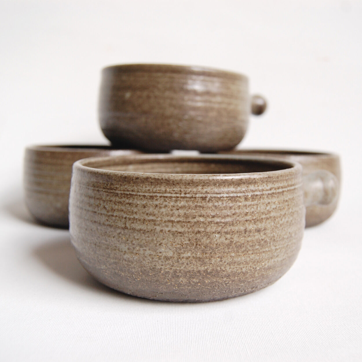 Set of 4 bowls and 4 plates by Thèrèse Bataille for the workshop of Dour 1970s