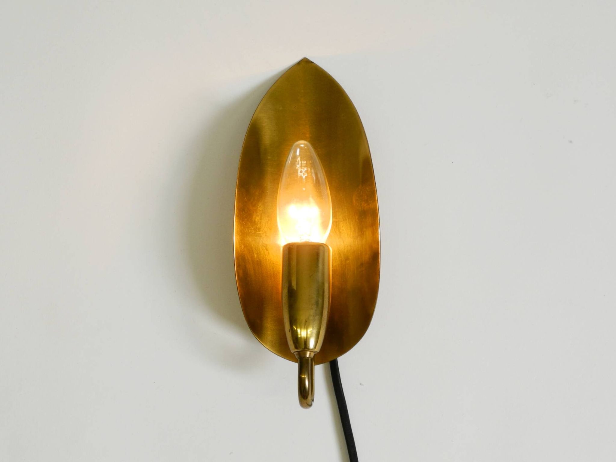 Beautiful original Mid Century Modern cone wall lamp made of brass