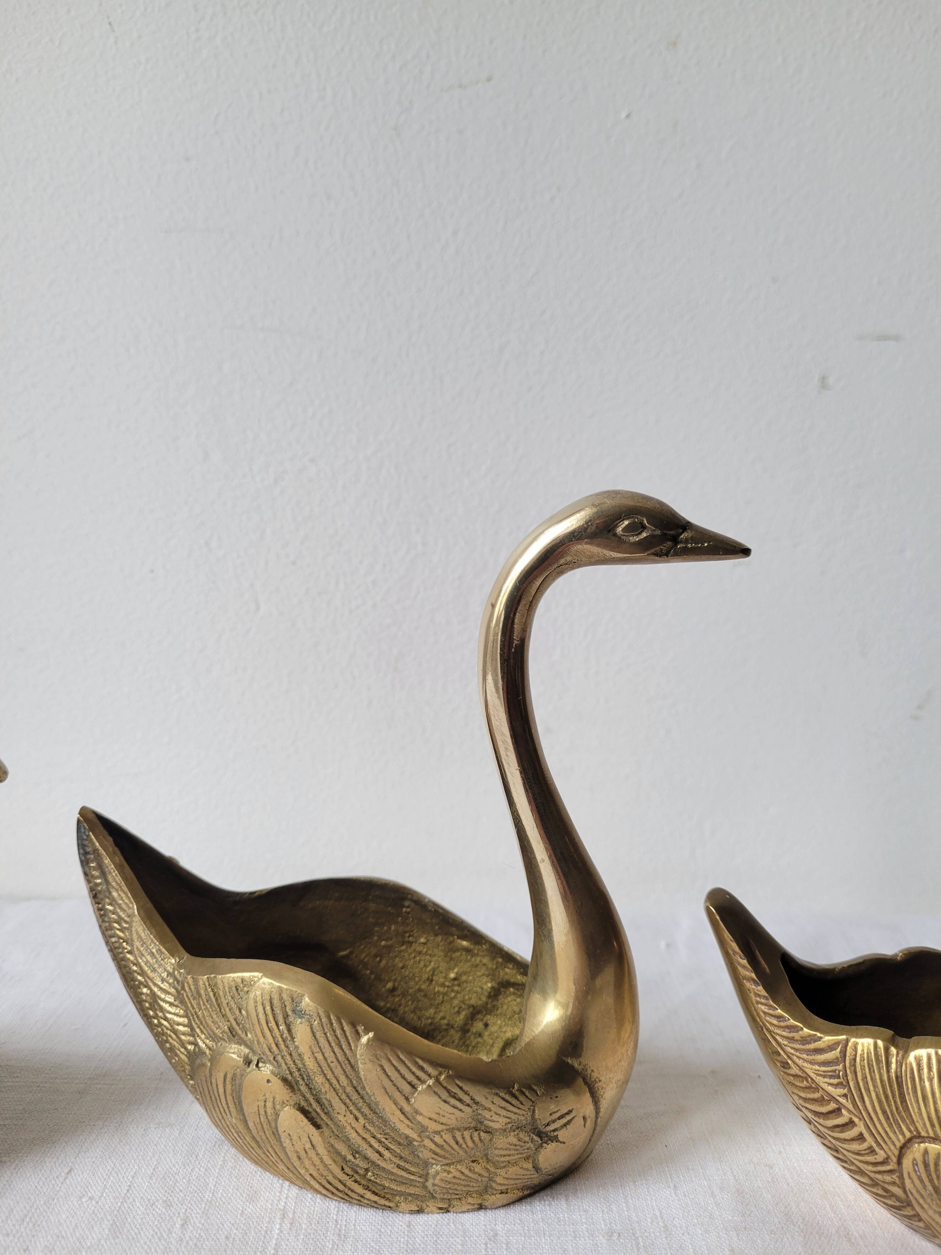 Trio of zoomorphic brass swan empty pockets